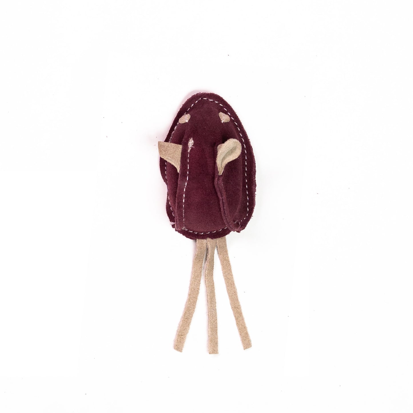 Handcrafted maroon toy with beige strings on white background.