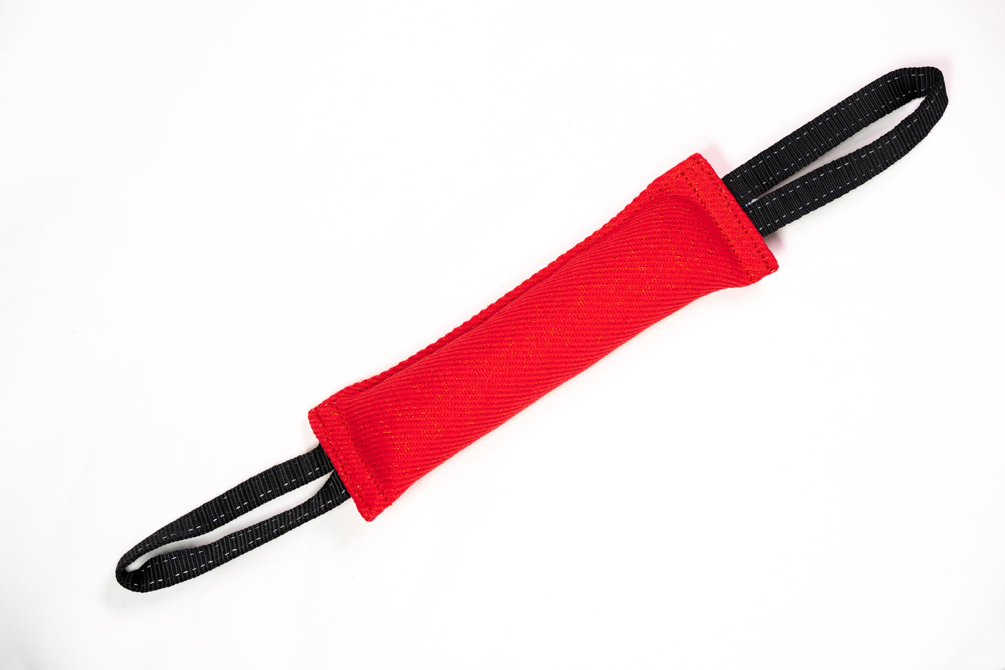 Red tug toy with 2 black straps on white background