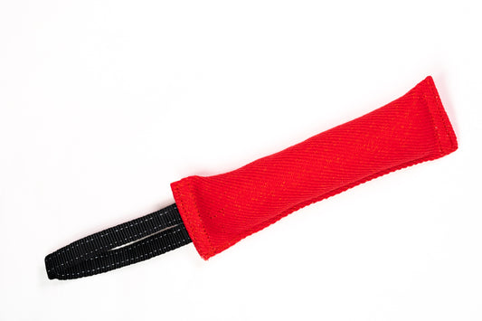 Red fabric tug toy with black handle