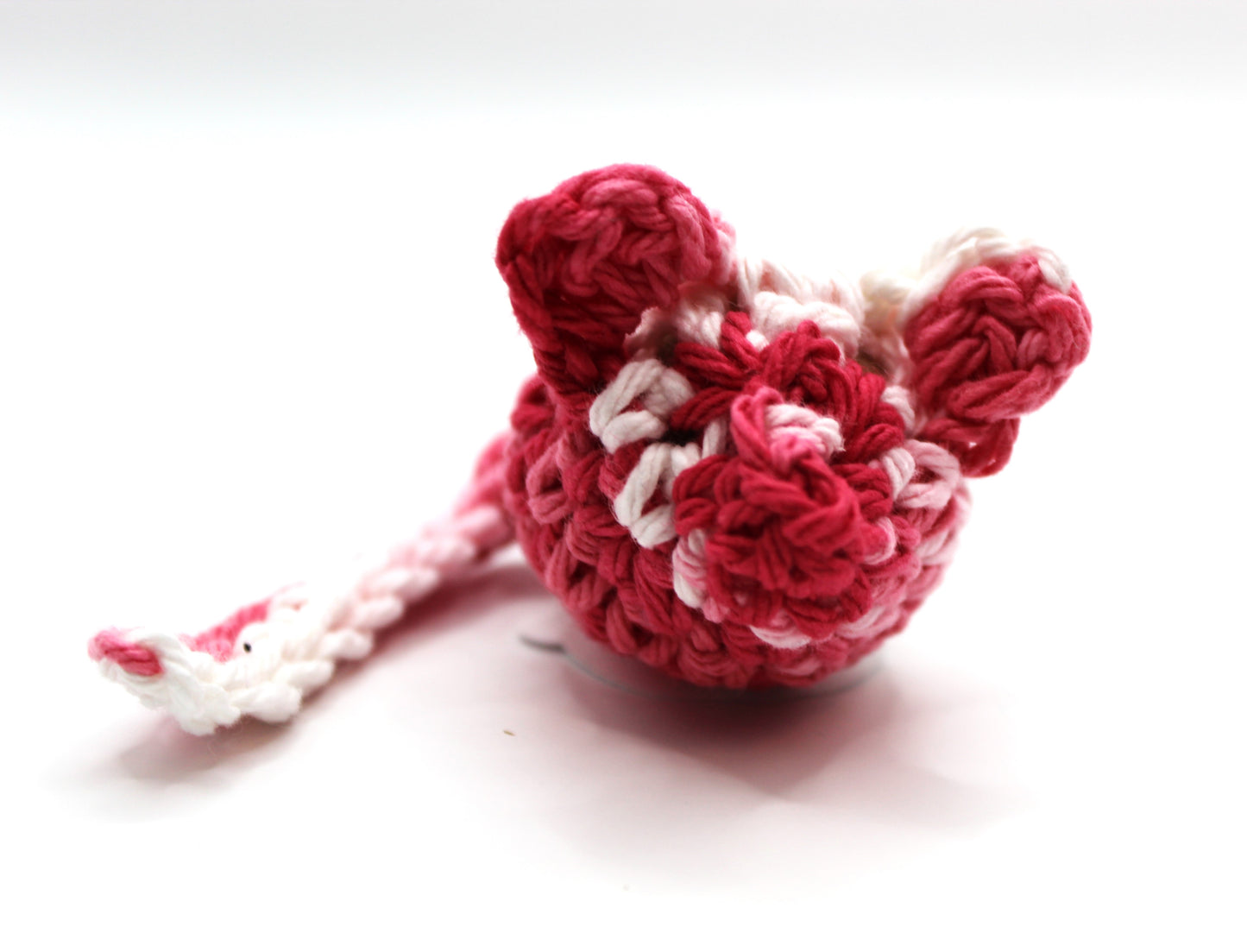 Crocheted pink and white mouse toy