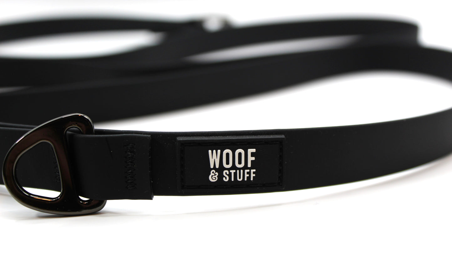Black dog leash with 'Woof & Stuff' label