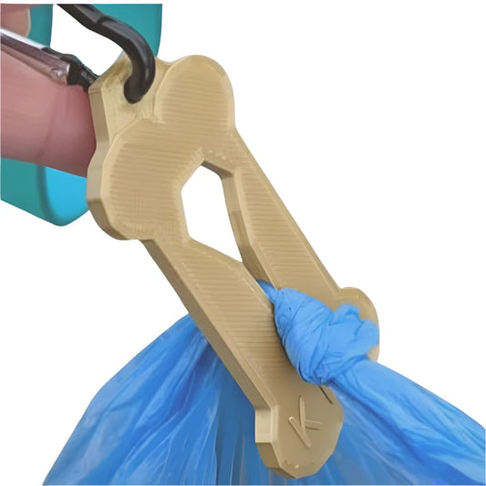 Bone shaped keychain with hole in middle to hold used poop bags
