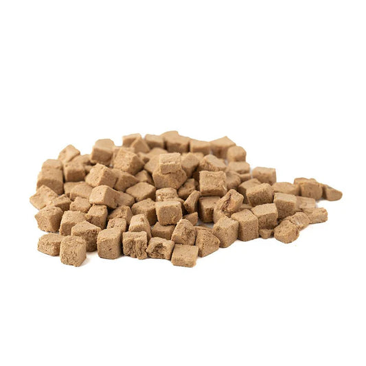 Pile of small, cube-shaped salmon pet food treats